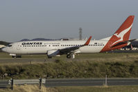 VH-VXG @ YBBN - VXG taxing to the A3 holding point - by V8Bathurst888