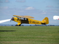 G-AGIV @ EGHA - taxying past a gap in line up - by magnaman