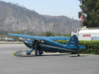 N97344 @ SZP - 1946 Universal Stinson 108 VOYAGER, Franklin 6A4165 165 Hp, at Fuel Dock with local A&P looking it over. - by Doug Robertson