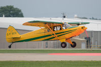 C-FSCU @ KOSH - Landing on the red spot - by alanh