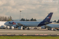 N667FE @ CYVR - Parked in front of FedEx hangar - by Remi Farvacque