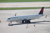 N301DN @ KTPA - Delta Flight 828 (N301DN) pushes back from the gate at Tampa International Airport prior to a flight to Hartsfield-Jackson Atlanta International Airport