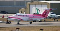 N848UP @ DAB - Wheels Up has a special painted Breast Cancer Awareness plane in pink. They are also coming out with an aqua colored one for Ovarian Cancer soon