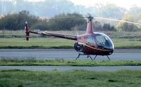 G-OCOV @ EGFH - Resident R22 Beta II operated by HeliAir Wales. - by Roger Winser