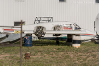 N4219P @ CYYE - Fuselage in back with wings in front. Tail not observed.