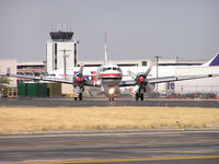 C-FKFB @ KBOI - Taxing out from NIFC ramp. Old control tower in background. Torn down several years later. - by Gerald Howard