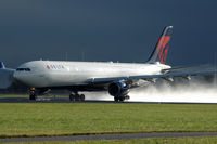 N815NW - Delta Air Lines Airbus A330-323 taking off from a wet runway at Schiphol airport, the Netherlands. - by Van Propeller
