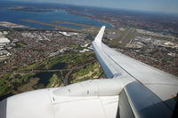 ZK-ZQE - Climbing out of Sydney, passing the airport we just took off from, and on our way to Auckland - by Micha Lueck