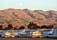 N3912R @ KRHV - Locally-based 1966 Cessna 172H parked at its tie down at Reid Hillview Airport, San Jose, CA. Full moon in background. - by Chris Leipelt