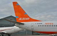 EI-EFW @ EGHH - Close up detail of Jeju Air tail - by John Coates