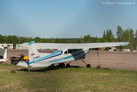 C-GKSJ @ CYYE - Parked in front of private hanger, NE part of airport.