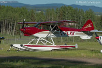 C-FLKK @ CYYD - Parked at east end of airport with other private craft.