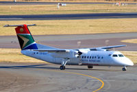 ZS-NLX @ FAJS - De Havilland Canada DHC-8-315 Dash 8 [348] (South African Express) Johannesburg Int'l~ZS 19/09/2006. Taken through the glass of the terminal. - by Ray Barber