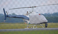 N828HA @ KDAN - 1980 Bell 206B in Danville Va. in town covering race at nearby Virginia International Raceway - by Richard T Davis
