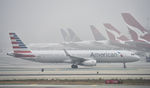 N119NN @ KLAX - Taxiing at LAX on a foggy morning - by Todd Royer