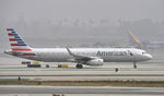 N113AN @ KLAX - Taxiing at LAX on a foggy morning - by Todd Royer