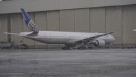 N2331U @ KSFO - United's new and first 777-300 on a rainy ramp. - by Clayton Eddy