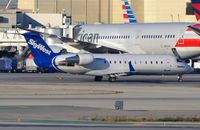N951SW @ KLAX - Skywest CL200 taxying to its stand. - by FerryPNL