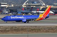 N8665D @ KLAX - Southwest B738 vacating the runway. - by FerryPNL