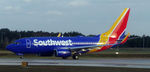 N7708E @ KMCO - Southwest Airlines Flight 4409 taxiing for taking off from Orlando - by laferrierem