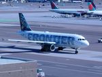 N923FR @ PHX - Taxying over the Skybridge - by Keith Sowter