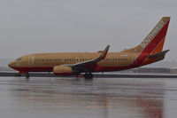 N714CB @ KBOI - Taxi off RWY 28R to the ramp in a driving rain storm. - by Gerald Howard