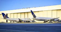 N2333U @ SFO - 747-400 next to it's new replacement, 777-300er. SFO. 2017. - by Clayton Eddy