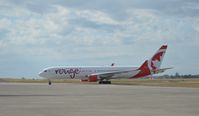 C-FMWV @ MTPP - Aircraft Air Canada Rouge landing at the PAP - by Jonas Laurince