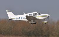 G-BRTX @ EGFH - Resident Piper Warrior operated by Cambrian Flying Club departing Runway 04. - by Roger Winser