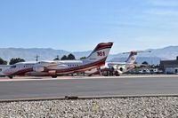 N354AC @ KBOI - Taxiing onto NIFC ramp for fire retardant refill. - by Gerald Howard