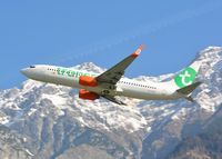 PH-GGX @ LOWI - Transavia B737 rocketing out of LOWI, Innsbruck with the austrian alps in the background - by Paul H