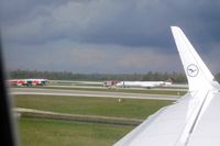 D-ACNM @ EDDM - Not sure what the incident was, but there were 4+ fire engines plus airport vehicles surrounding the aircraft, which stopped next to the active runway. - by Micha Lueck