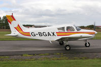 G-BGAX @ EGBR - Piper PA-28-140 Cherokee G-BGAX at Breighton Airfield's Helicopter Fly-In. September 12th 2010. - by Malcolm Clarke
