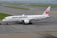 JA828J @ VHHH - After a good night's rest JAL B788 is towed to the gate for its return flight to Japan. - by FerryPNL