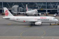 B-HSI @ VHHH - Dragonair A320 pushed back. - by FerryPNL