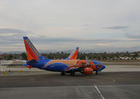 N224WN @ KLAX - SOUTHWEST 2005 Boeing 737-7H4 in special colors for NBA Slam Dunk taxiing @ LAX in late afternoon - by Steve Nation