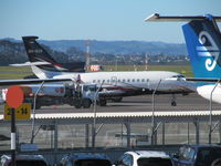 OO-SCR @ NZAA - from car park roof across apron - by magnaman