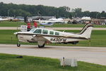 N430FM @ OSH - 2000 Raytheon Aircraft Company A36, c/n: E-3319 - by Timothy Aanerud