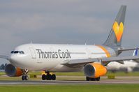 G-MLJL @ EGCC - Thomas Cook A332 inhaling moist air while powering up. - by FerryPNL