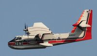 N385AC - Picking up water from the Columbia River upstream of the Bonneville Dam and depositing it on a nearby wild fire. - by Pierre Castille