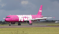 TF-KID @ EGSH - Full flaps reverse thrust slowing down on a wet summers day at Norwich - by AirbusA320