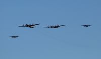 N69972 @ OSH - Missing Man formation with Doc, Fifi and a couple B-25s - by Florida Metal