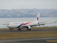 9M-MTA @ NZAA - reverse thrust - by magnaman