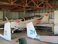 ZK-VMC - in crowded glider hangar at Drury - by magnaman