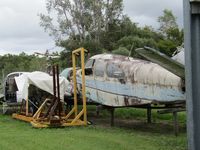 VH-AWC - with bits of ZK-HCQ in far background and PK-ZHB hulk too. - at Caloundra Museum - by magnaman
