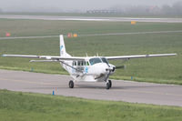 2-CREW @ EGJB - Waves' Caravan taxiing past the Aero Club at Guernsey on a rather murky morning - by alanh