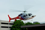 N428CF @ TE30 - Departing the Harris Hospital ground helo-pad