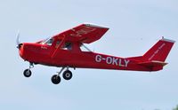 G-OKLY @ EGFH - Visiting Cessna 150K departing runway 22. - by Roger Winser