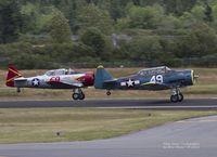 N3173L @ KPWT - A 1945 AT-6 taking off with a T-6G. - by Eric Olsen