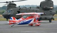 G-EWIZ @ EGFH - Visiting Pitts Special biplane about to depart and display on day 2 of WNAS18. RAF Chjinook HC.6A helicopter ZH891 in the background. - by Roger Winser